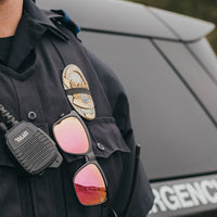Police man wearing nado sunset sunglasses